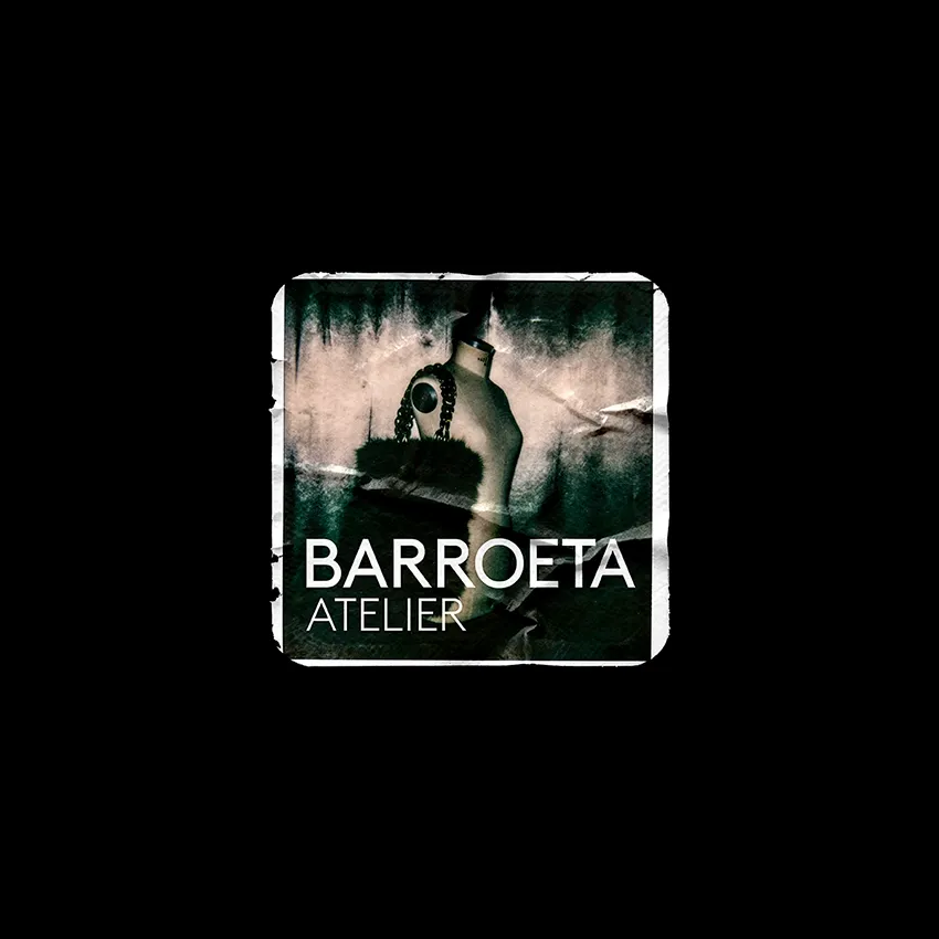 Square, weathered-texture label showing a dark image of a perfume bottle, with the Barroeta Atelier wordmark on a black background